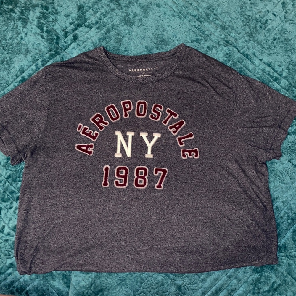 -Blue Aeropostale shirt with red and white embroidery brand title on front